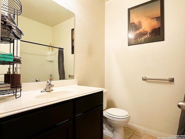 bathroom with vanity, tile patterned flooring, toilet, and a shower with shower curtain