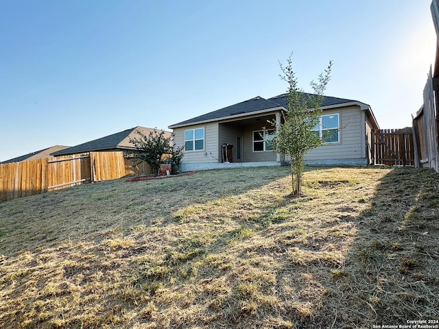 280 Crysanthemum, New Braunfels, TX 78130 - back of house featuring a fenced backyard and a lawn