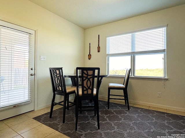 dining area featuring tile patterned flooring