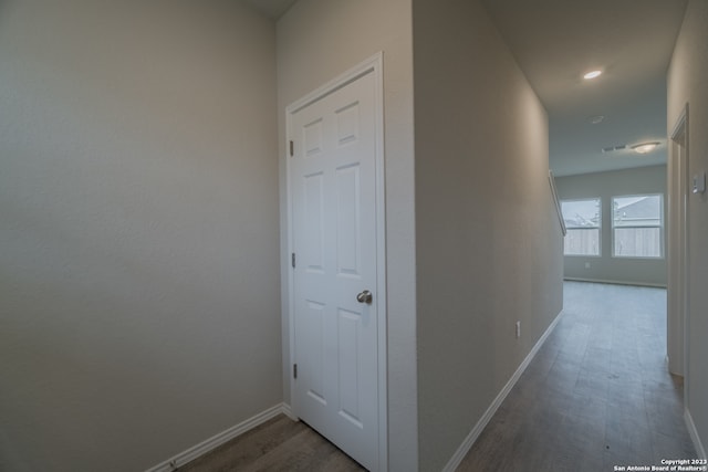 hallway with dark wood-type flooring