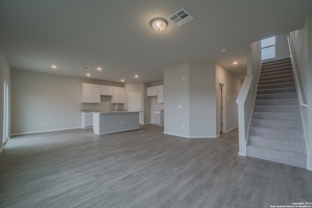 unfurnished living room with light hardwood / wood-style floors