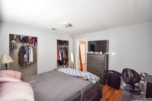 bedroom with hardwood / wood-style floors