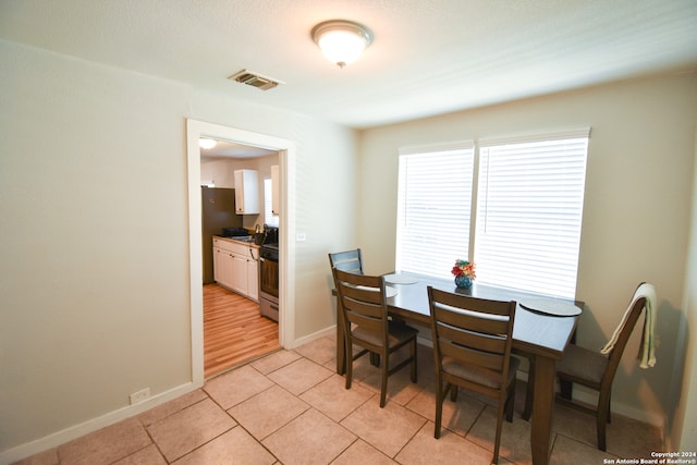 view of tiled dining space