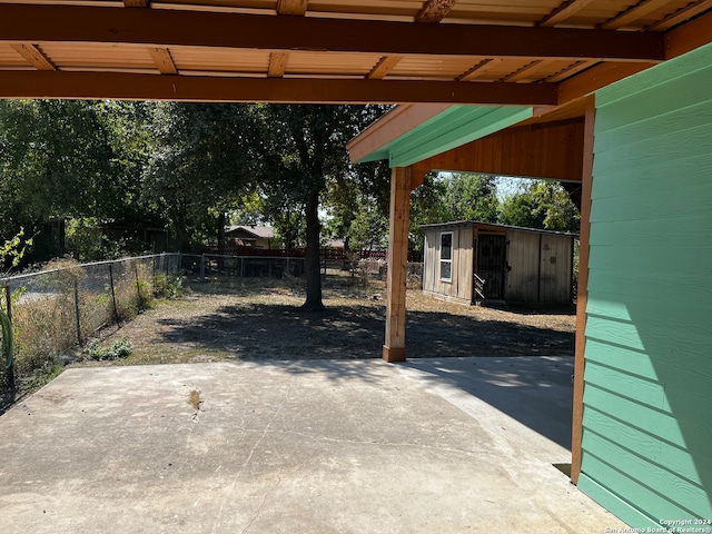 view of patio with a storage unit