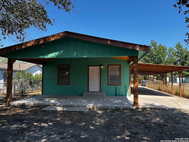 view of front of home featuring a carport