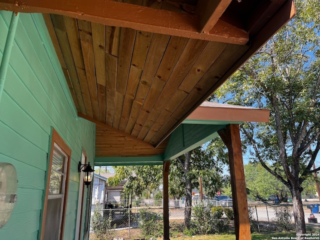 exterior space featuring wood walls and wood ceiling