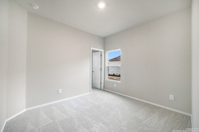 empty room with light colored carpet