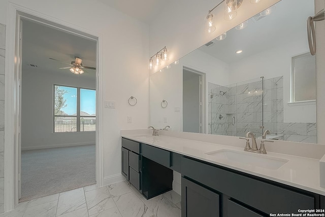 bathroom with vanity, ceiling fan, and an enclosed shower