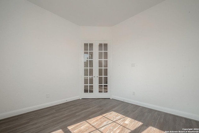 unfurnished room featuring french doors and wood-type flooring