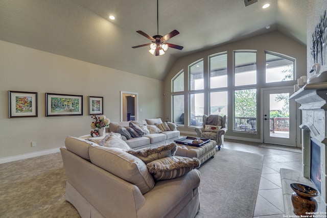 tiled living room featuring high vaulted ceiling, a fireplace, ceiling fan, and a textured ceiling