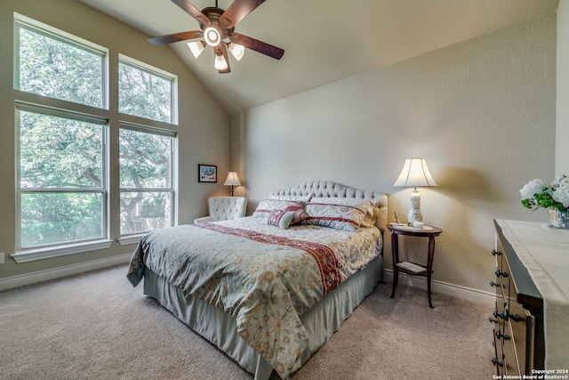 bedroom featuring ceiling fan, light carpet, and vaulted ceiling