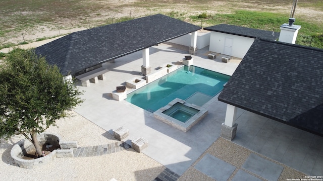 view of pool featuring an in ground hot tub and a patio area