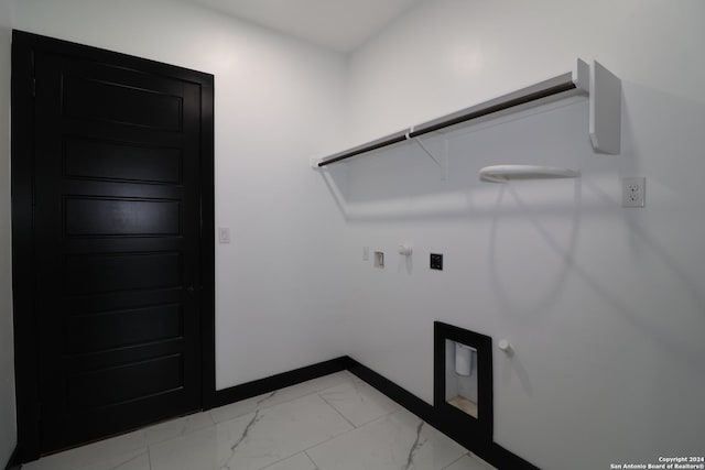 washroom with baseboards, hookup for a washing machine, marble finish floor, gas dryer hookup, and laundry area