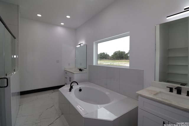 bathroom with independent shower and bath and vanity