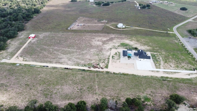 birds eye view of property featuring a rural view