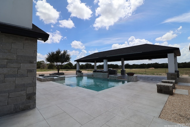 view of swimming pool with a gazebo, an in ground hot tub, and a patio area