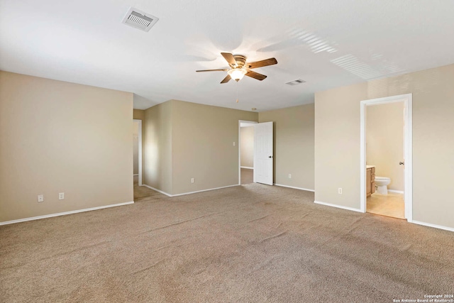 carpeted empty room featuring ceiling fan