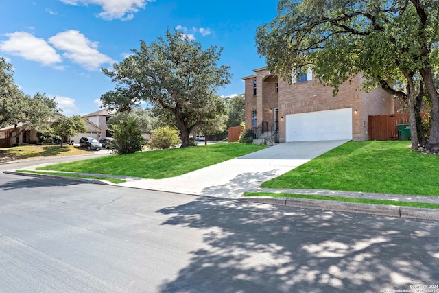 view of front facade with a front lawn and a garage