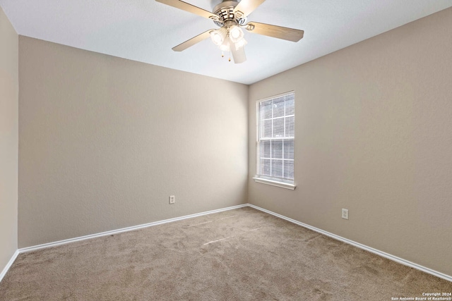 unfurnished room with ceiling fan and carpet flooring