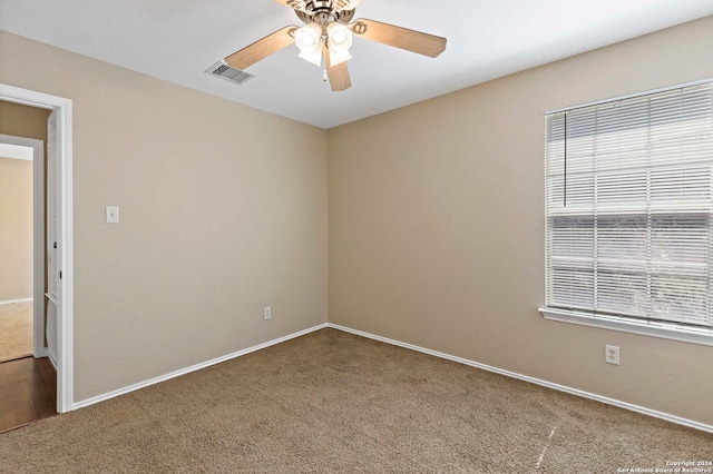 carpeted empty room with ceiling fan