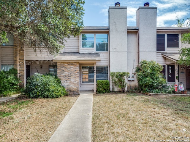 view of property with a front lawn