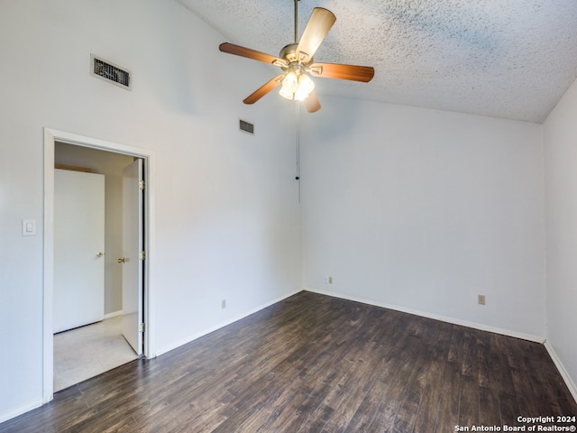 empty room featuring ceiling fan, a textured ceiling, dark hardwood / wood-style flooring, and high vaulted ceiling