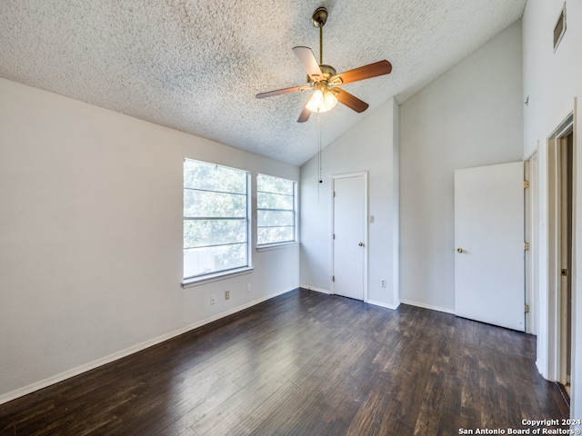 unfurnished bedroom with high vaulted ceiling, dark hardwood / wood-style flooring, ceiling fan, and a textured ceiling