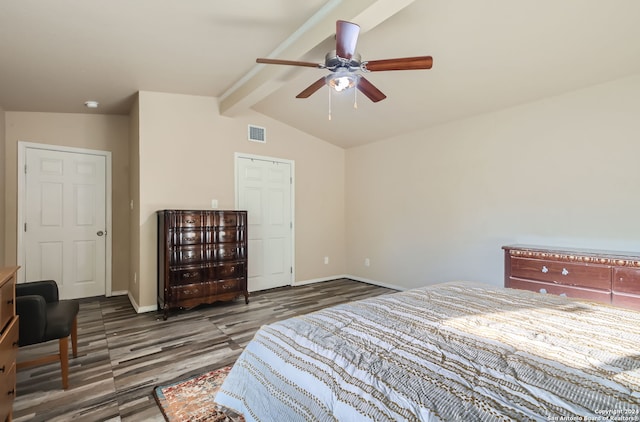 bedroom featuring dark wood-type flooring, ceiling fan, and lofted ceiling with beams