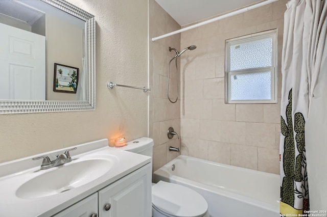 full bathroom with vanity, shower / tub combo with curtain, and toilet