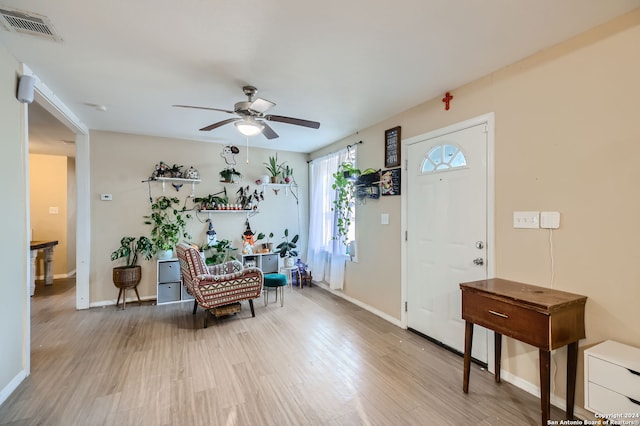 entrance foyer featuring ceiling fan and light wood-type flooring