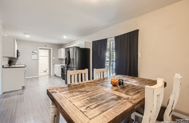 dining room featuring light hardwood / wood-style flooring