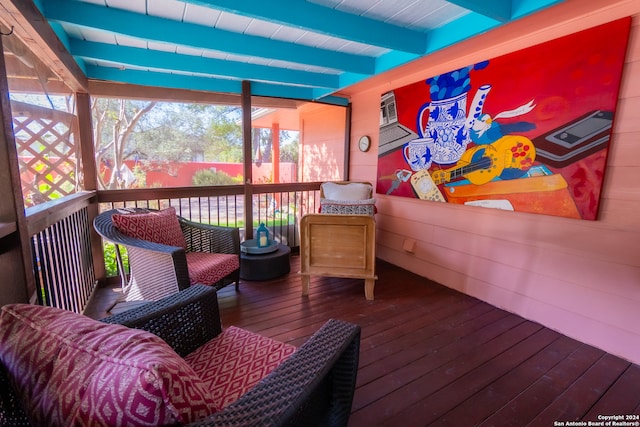 sunroom with beamed ceiling