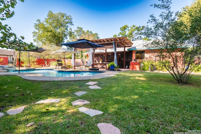 view of swimming pool with a lawn and a patio area