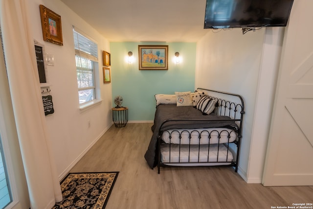 bedroom with light wood-type flooring