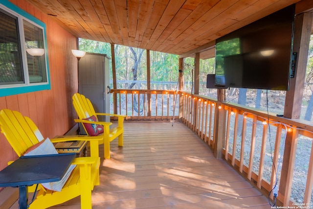 sunroom / solarium featuring wood ceiling