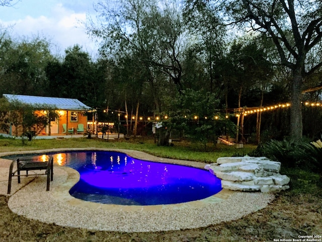 view of swimming pool with a patio area