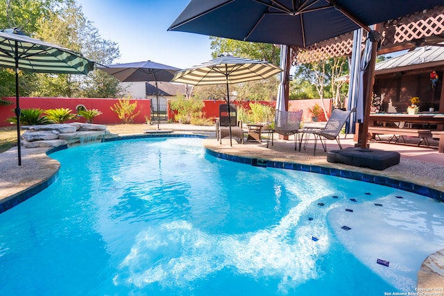 view of swimming pool featuring a patio area