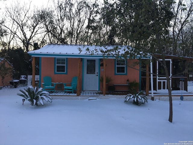 view of snow covered house