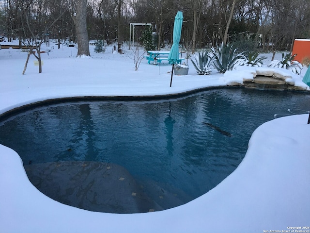 view of snow covered pool