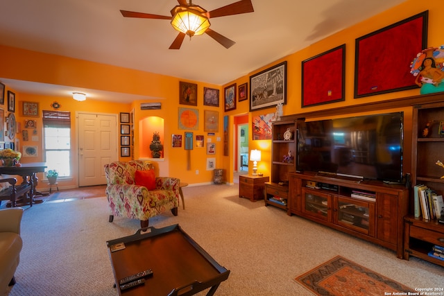 living room featuring light colored carpet and ceiling fan