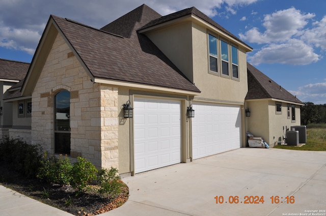 view of side of home featuring central AC unit