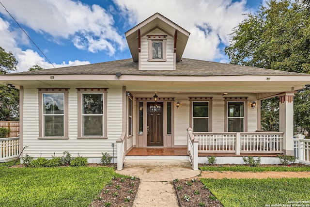 bungalow-style house featuring a front yard and a porch