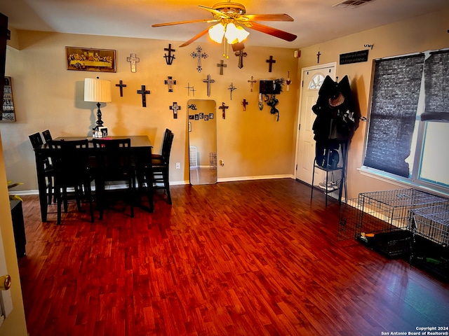 dining area with hardwood / wood-style floors and ceiling fan