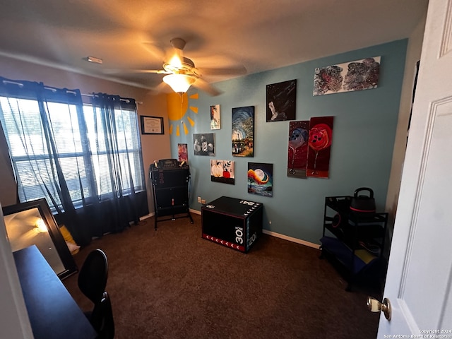 interior space with ceiling fan