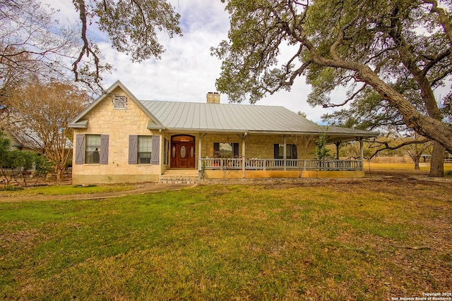 view of front of property with a front yard and a porch