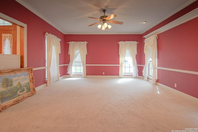 interior space with ceiling fan and crown molding