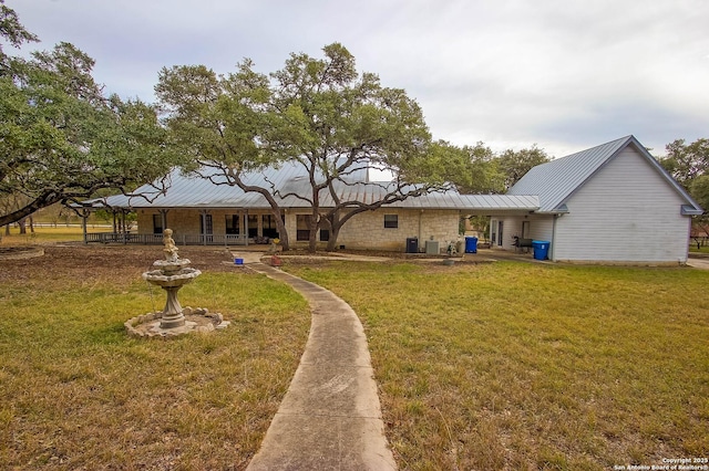 back of house with a yard