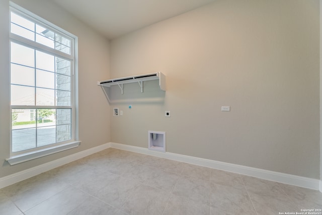 clothes washing area with hookup for a washing machine, hookup for a gas dryer, light tile patterned floors, and hookup for an electric dryer