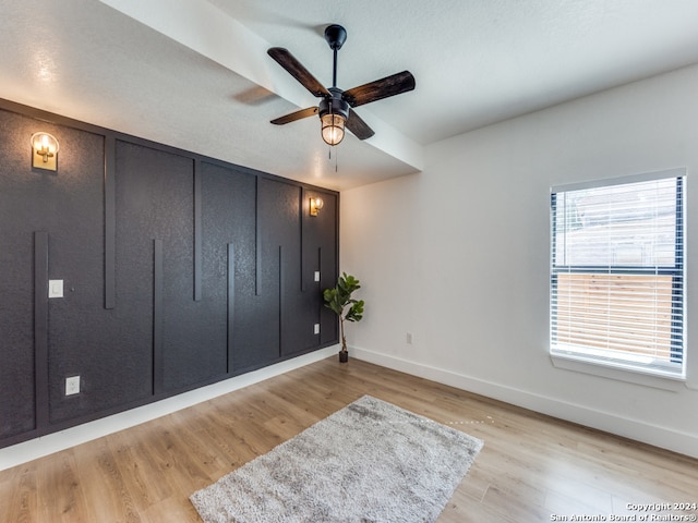 bedroom with light hardwood / wood-style flooring and ceiling fan