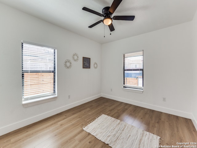 spare room featuring ceiling fan and light hardwood / wood-style floors